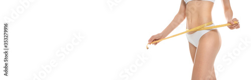 Closeup view of slim woman in underwear with measuring tape on white background. Banner design