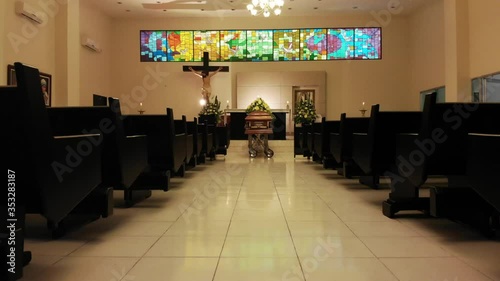 coffin with flowers in chapel