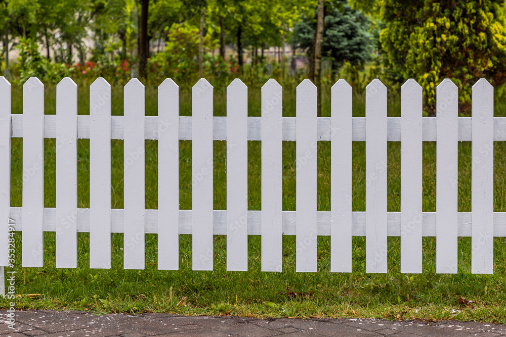 Wooden white fences around the garden