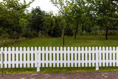 Wooden white fences around the garden