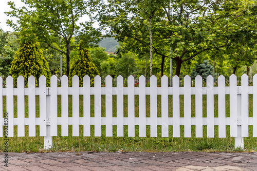 Wooden white fences around the garden