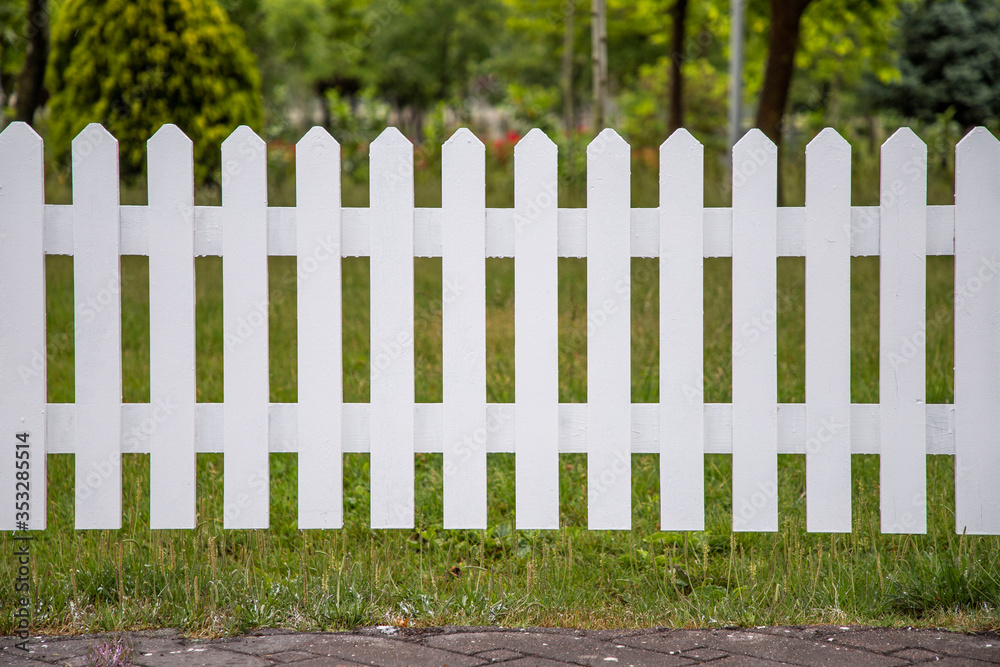 Wooden white fences around the garden Wooden white fences around the garden