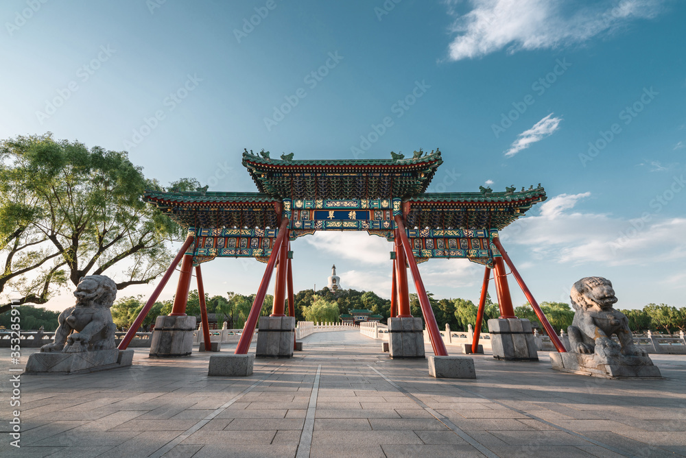 Memorial archway with beautiful sunset in Beihai park, Beijing, China. Translation: Accumulation of jade. Memorial archway with beautiful sunset in Beihai park, Beijing, China. Translation: Accumulation of jade.