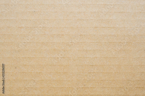 Brown eco recycled cardboard paper sheet texture background © Piman Khrutmuang