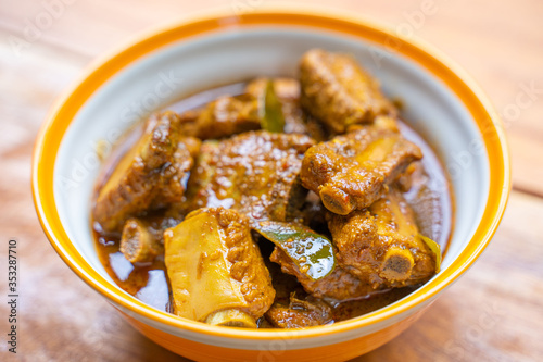 pork bone with spices curry paste soup photo