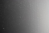 Rain drops on a metal wall panel