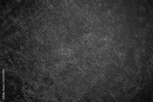 Texture of old black and gray concrete wall for background