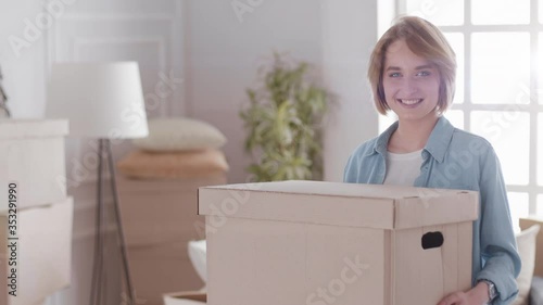 Excited Young Couple Unpacking Things, Opening Box And putting