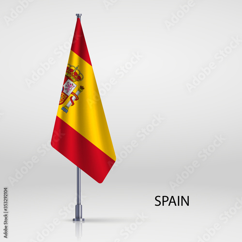 Spain hanging flag on flagpole