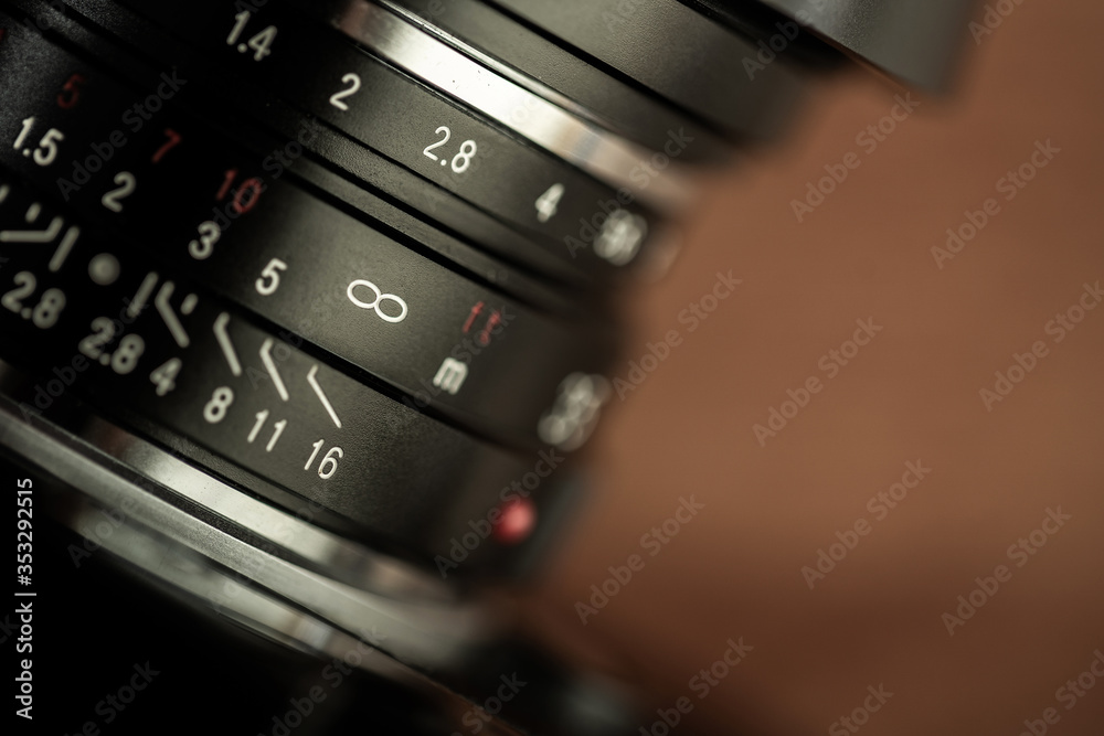 Focus dial of a vintage manual lens. infinity on a scale of the lens