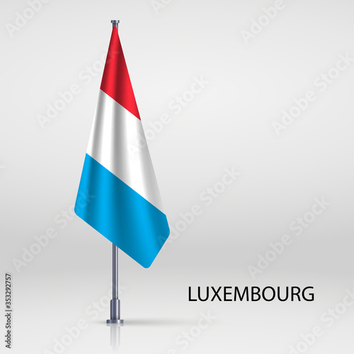 luxembourg hanging flag on flagpole photo