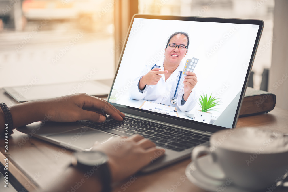 © photobyphotoboy - The patient's viewpoint consult with the doctor via social media such as laptop, smartphone, almost. The work for home concept of doctors and patients.