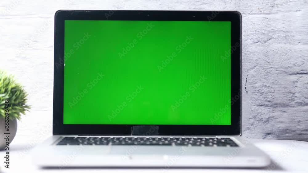 Laptop screen with green display isolated on white. Laptop screen with green display isolated on white.