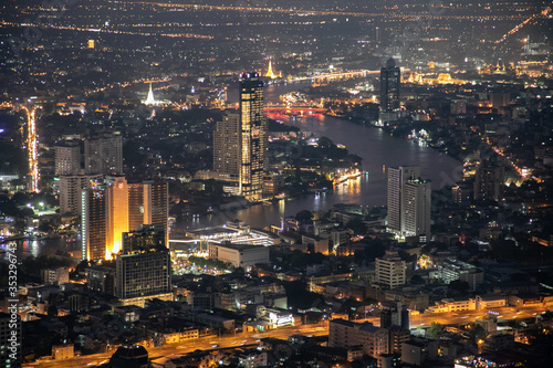 panoramic skyline of Bangkok by night from King Power Mahanakhon, Bangkok, Thailand