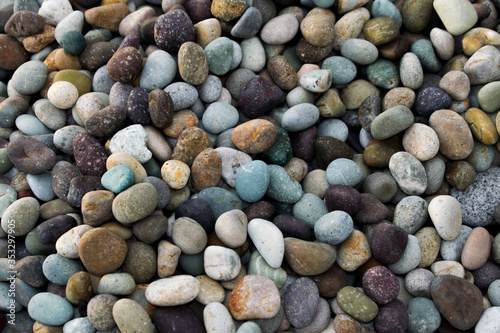 Multi-colored pebblestones on a pile