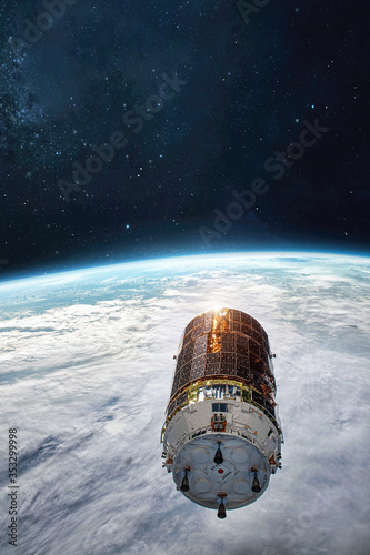 Fototapeta Naklejka Na Ścianę i Meble -  Cargo spaceship on orbit of the Earth planet. Satellite. Exploration of space. Elements of this image furnished by NASA	
