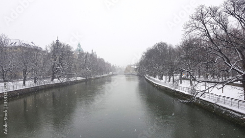 Winter view of the Isar river on the Ludwigsbrücke Bridge in Munich, Germany