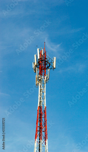 close up Red and White atenna Telecommunication tower with blue sky