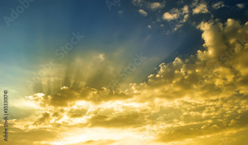 sunlight in gold cloud with blue sky