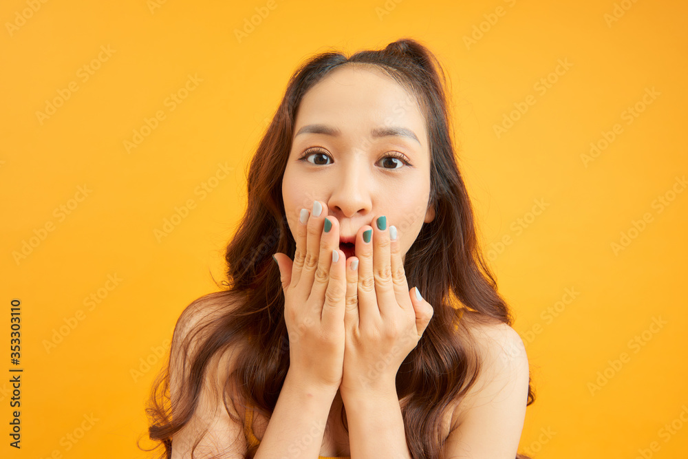Adorable girl porrtrait isolated over orange background. Adorable girl porrtrait isolated over orange background.