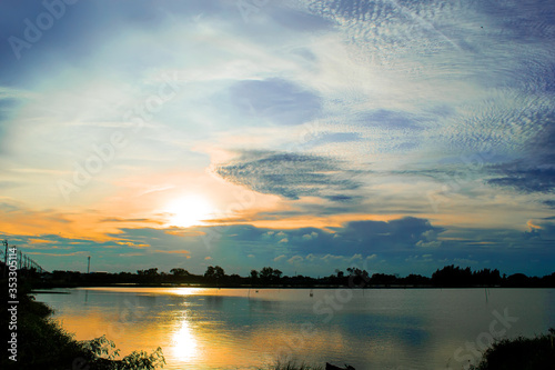 landscape sun down reflect light on lagoon © sarayutoat
