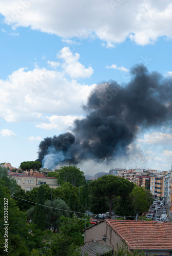 Black smoke caused by a fire in the Centocelle district of Rome 