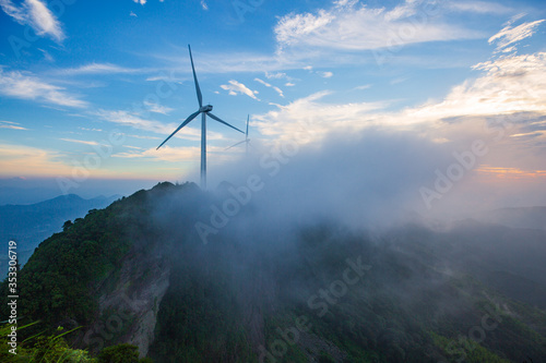 Windmill in the rainy season in the missing mountain in Heyuan, Guangdong, China