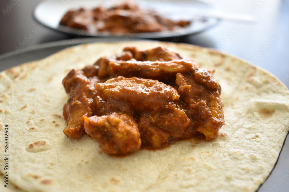Chicken curry with tacos naan bread.  Selective focus. 