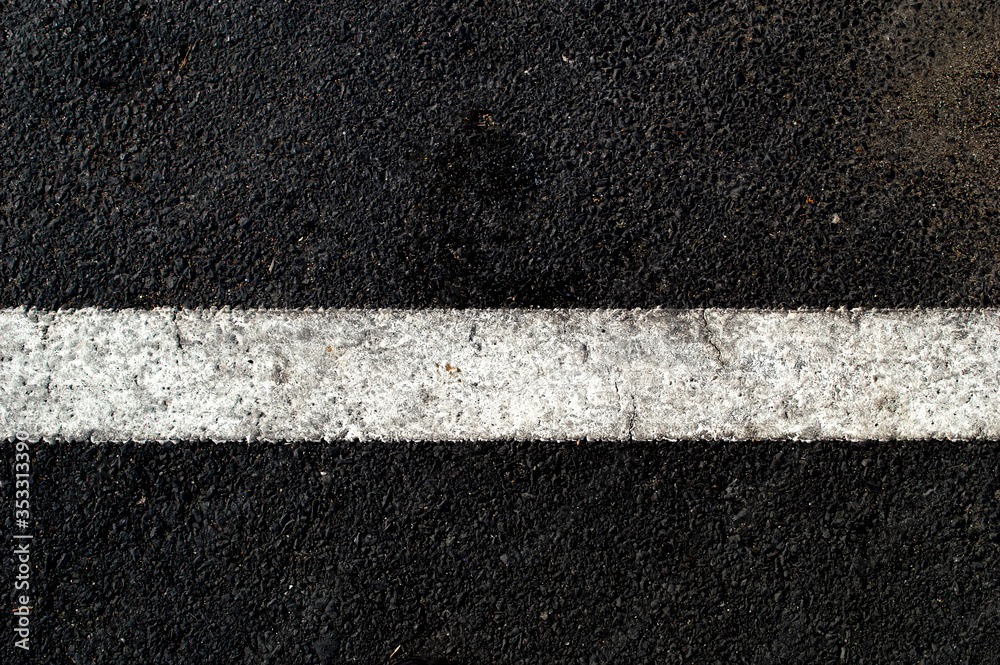 Fototapeta premium white on asphalt floor in parking
