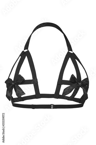 Detailed shot of a black harness made of textile straps with silk bows. The fashion body harness is isolated on the white background.  