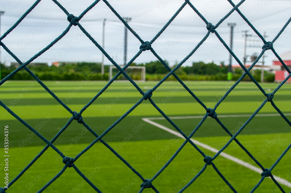 green net fance with soccer football background green net fance with soccer football background