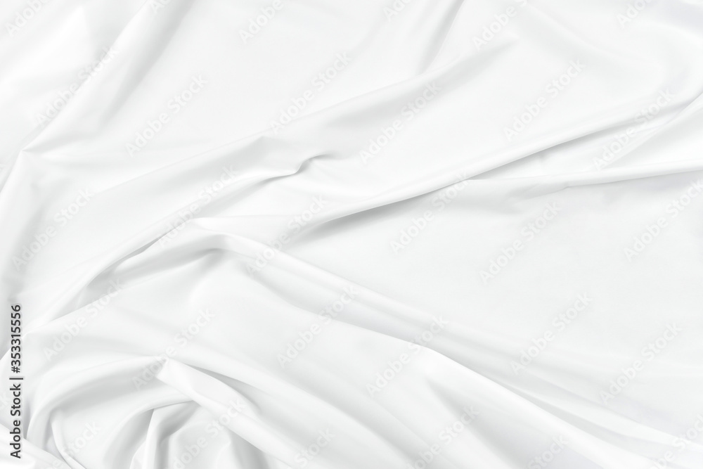 Abstract white fabric texture background. Cloth soft wave. Creases of satin, silk, and cotton.	