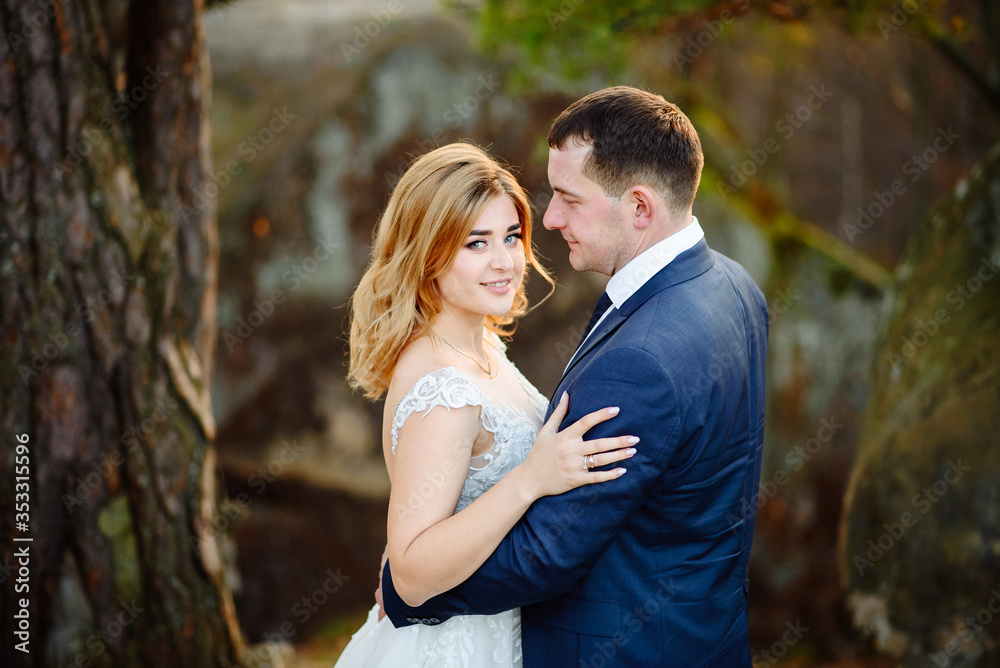 Bride and groom. Close-up. The couple is hugging.