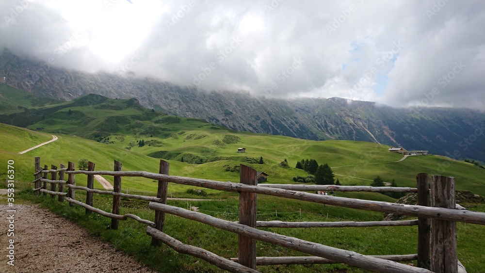 mountain landscape with fence and mountains
