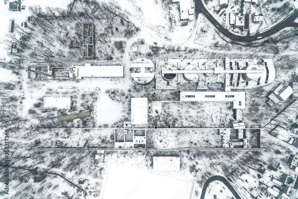 Fototapeta premium Old abandoned cement factory winter snow time in Bedzin Poland aerial drone photo