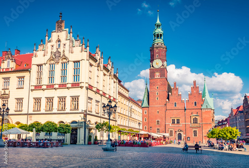 Sunny morning scene on Wroclaw Market Square with Town Hall. Splendid cityscape of historical capital of Silesia, Poland, Europe. Traveling concept background..