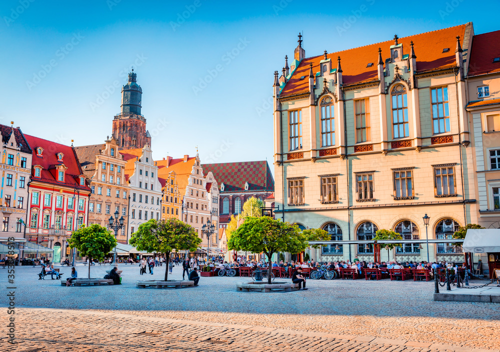 Colorful spring cityscape of Wroclaw, Market Square with Town Hall. Picturesque evening view of historical capital of Silesia, Poland, Europe. Vacation concept background..
