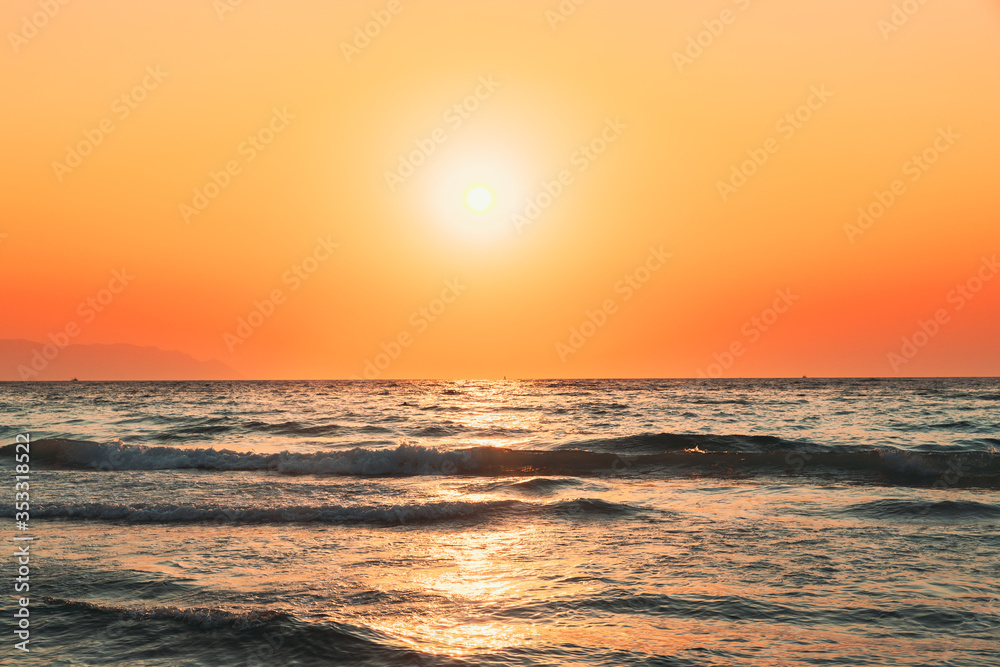 Evening Sun Sunshine Above Sea. Natural Sunset Sky Warm Colors. Ripple Seascape