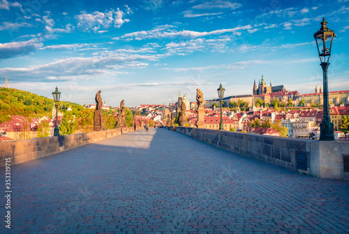 Impressive morning view of Charles Bridge, Prague Castle and St. Vitus cathedral on Vltava river. Bright summer cityscape of Prague, Czech Republic, Europe. Traveling concept background.. photo
