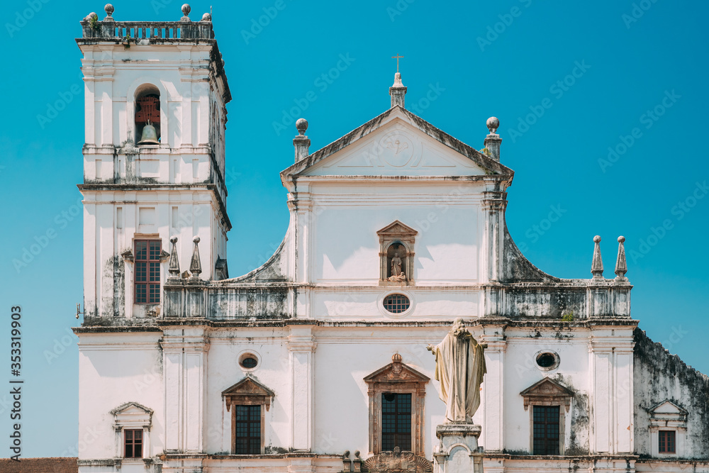 Fototapeta premium Old Goa, India. Cathedral Of St. Paul And Statue Of Jesus In Sunny Day