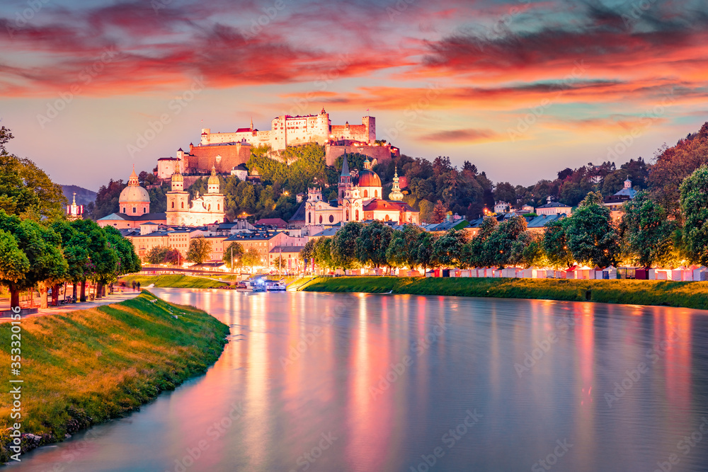 Superb summer view of Old town of Salzburg. Colorful sunset cityscape of Salzburg with Hohensalzburg Castle on background. Austria, Europe. Traveling concept background..