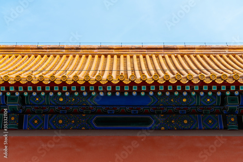 Chinese traditional red wall with blue sky. Minimal background.