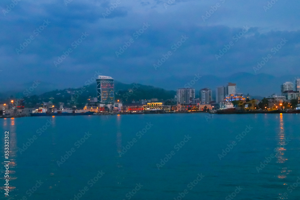 Batumi, Adjara, Georgia. View from the sea on illuminated resort town at evening