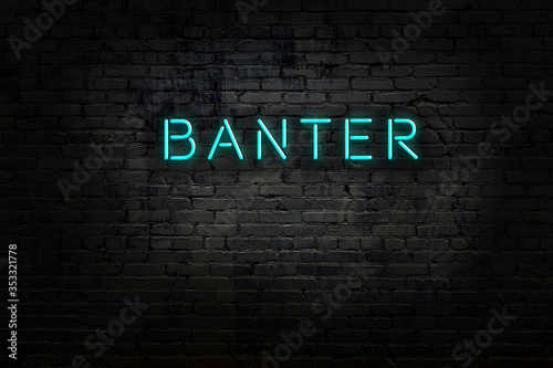 Neon sign with inscription banter against brick wall