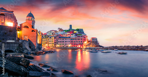 Incredible morning cityscape of Vernazza port. Magnificent summer sunrise on Liguria, Cinque Terre, Italy, Europe. Attractive seascape of Mediterranean sea. Traveling concept background.