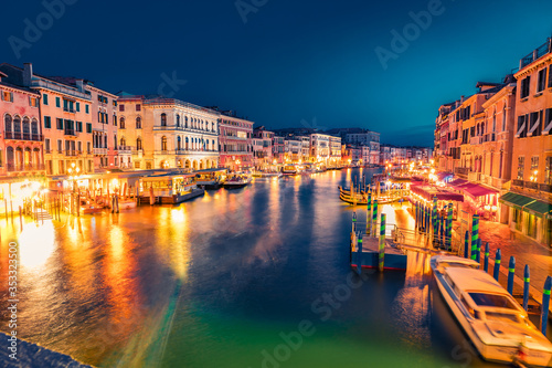 Spectacular evening scene of famous Canal Grande. Splendid summer view from Rialto Bridge of Venice, Italy, Europe. Beautiful evening seascape of Adriatic Sea. Traveling concept background.