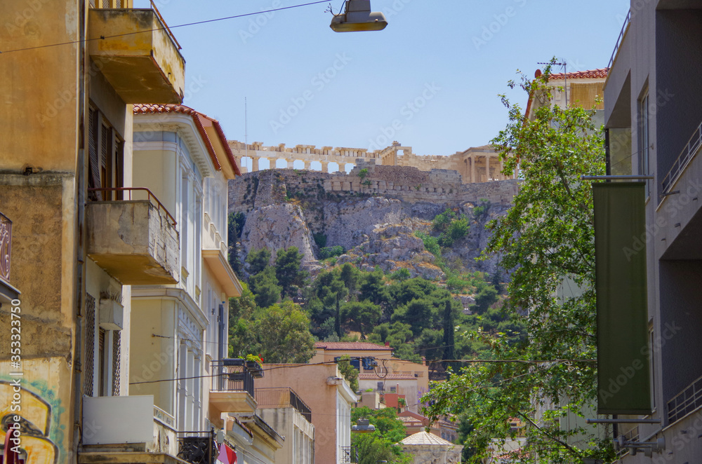Fototapeta Panorama of Athens with Acropolis hill, Greece. Famous old Acropolis is a top landmark of Athens. Landscape of the Athens city with classical Greek ruins. Scenic view of remains of ancient Athens.