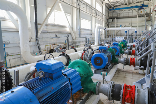 Modern pumping station at the water intake. Pipes, electric motors, pumping units.