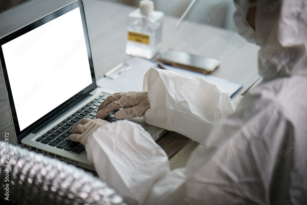 Woman in protective hazmat suit worker in laboratory computer analyzing in laboratory. to stop spreading coronavirus or COVID-19. Woman in protective hazmat suit worker in laboratory computer analyzing in laboratory. to stop spreading coronavirus or COVID-19.
