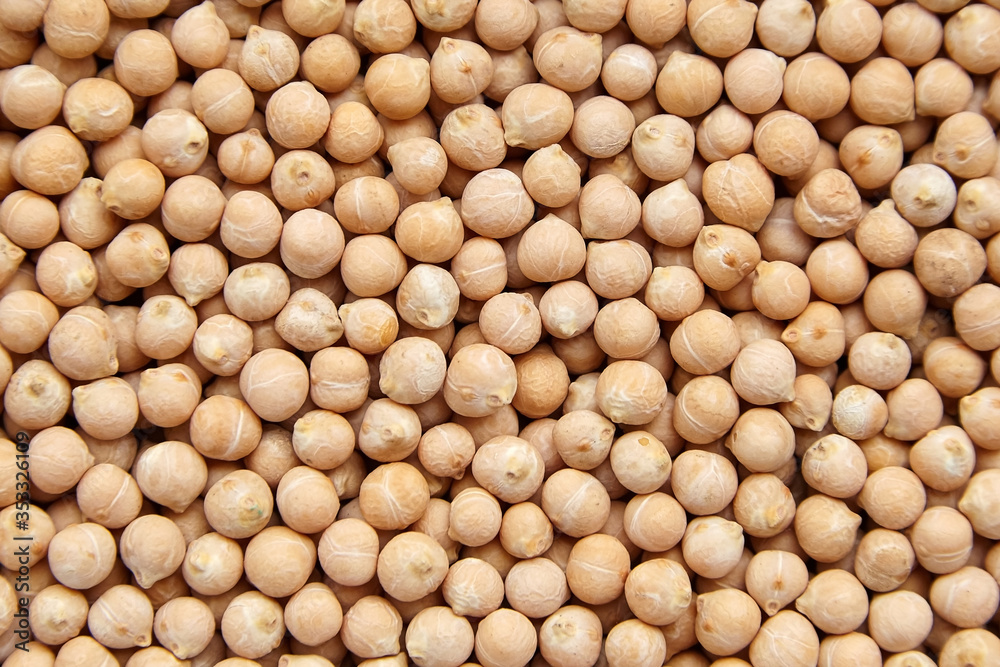 Chickpea seeds background, top view. Chick peas, or garbanzo beans Chickpea seeds background, top view. Chick peas, or garbanzo beans